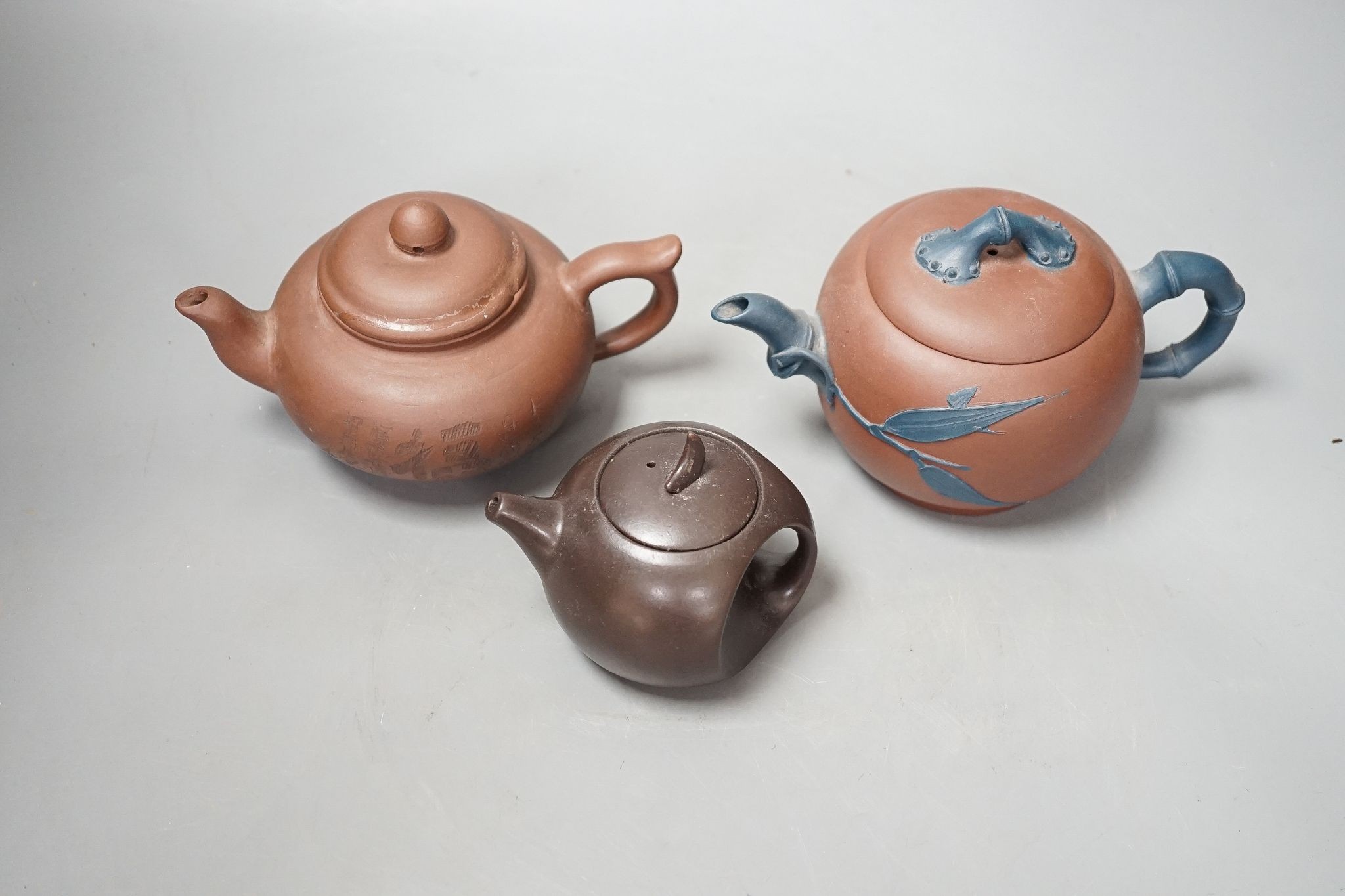 Three Chinese Yixing teapots, tallest 10cm